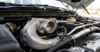 Close on the intake throttle and intake plumbing of a 6.7-litre Cummins INLINE-SIX turbo diesel in a Ram heavy-duty pickup engine bay